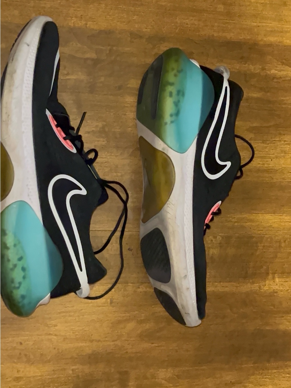 Nike Women’s Black Athletic Shoes with Teal and Pink Accents